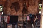 Household possessions stored under a Lao house