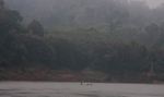 Boat crossing the Nam Ou river at Nong Khiaw