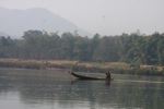 Man paddling across the Nam Ou river