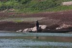 Man paddling along the Nam Ou river