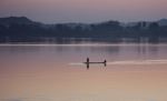Fisherman at sunrise on the Mekong