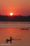 Men fishing on the Mekong in the early morning