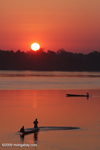 Men fishing on the Mekong at dawn